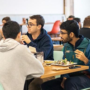 U N E students eating in the dining hall in the Danielle Ripich Commons on the Biddeford Campus